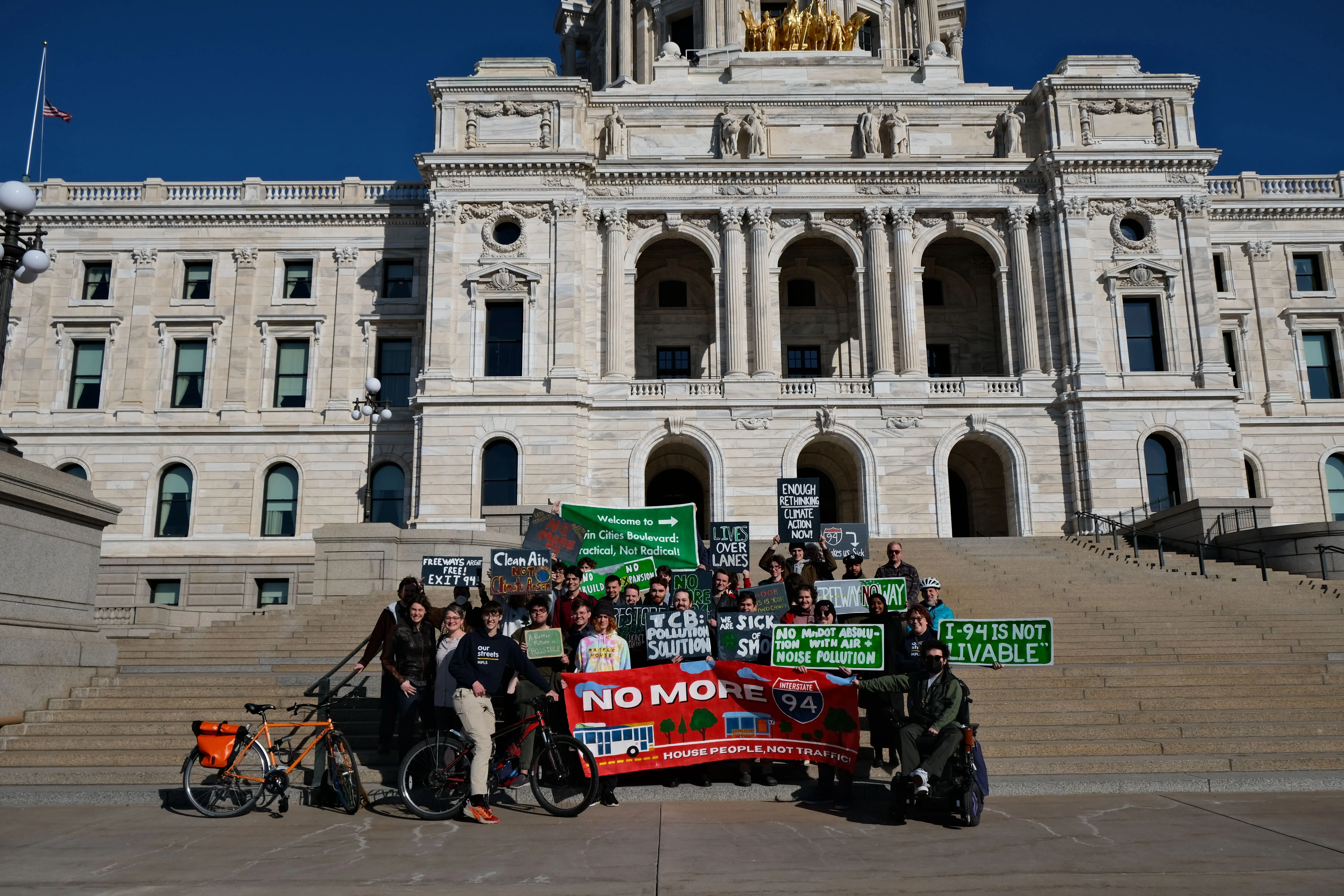 Group of Twin Cities Boulevard supporters with signs in front of the Minnesota State Capitol