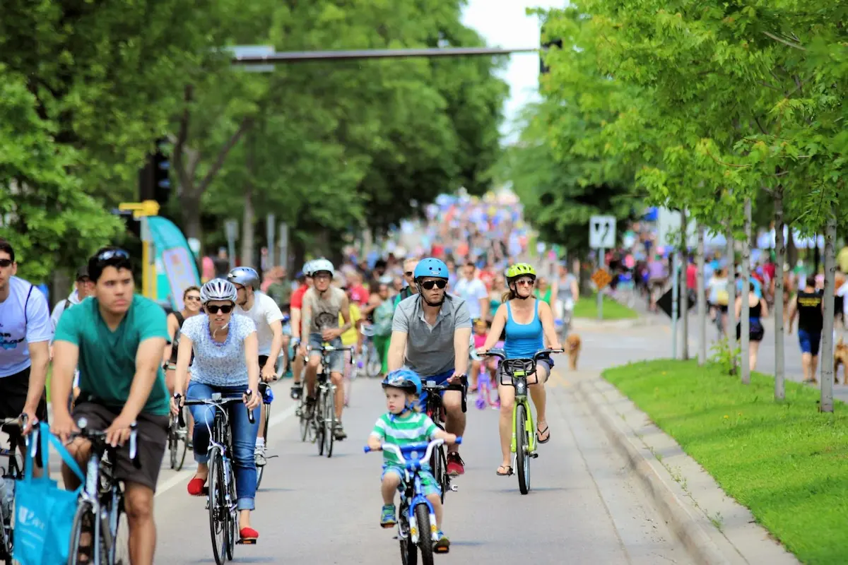 People biking down a closed Minnehaha avenue