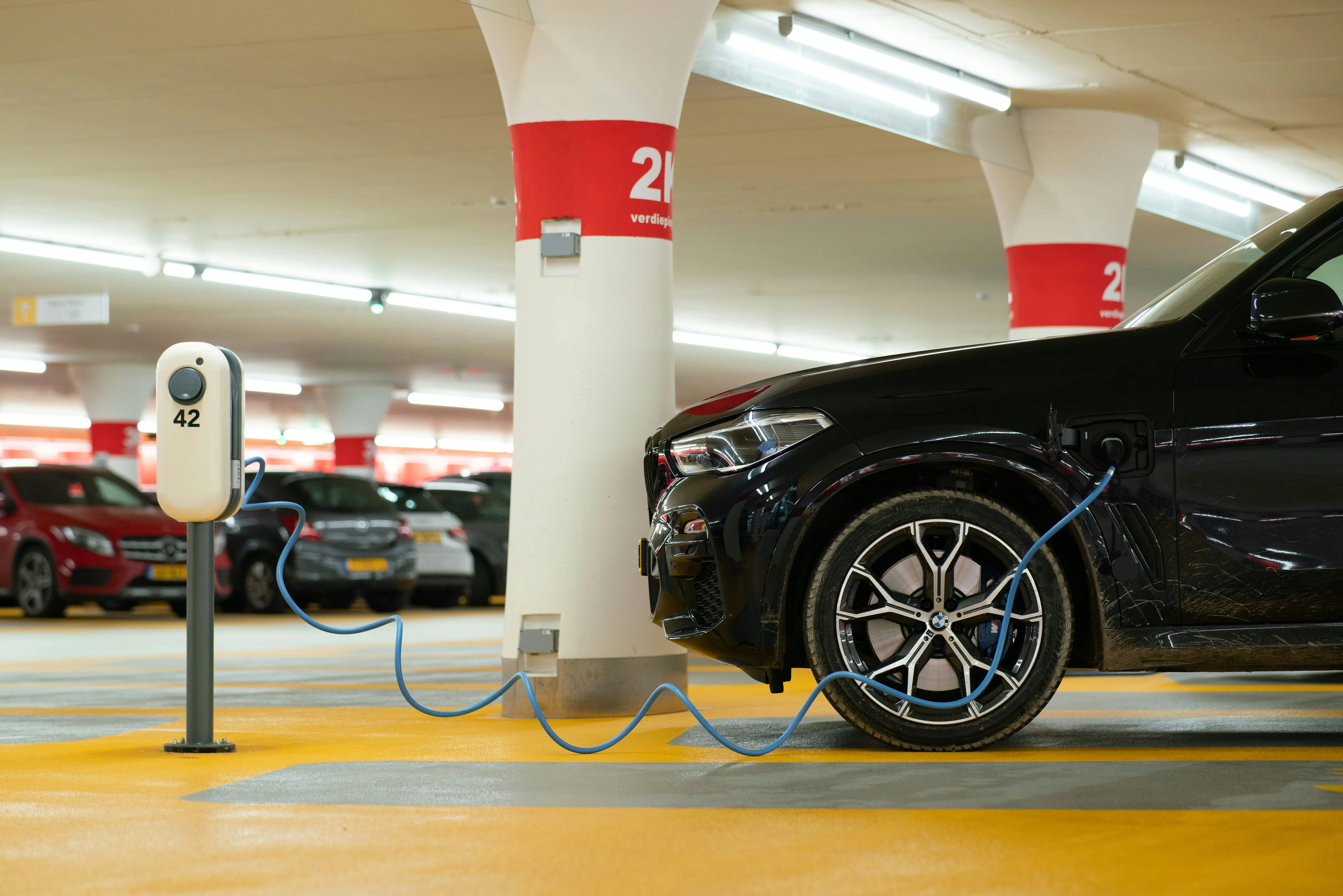 electric car charging in parking garage
