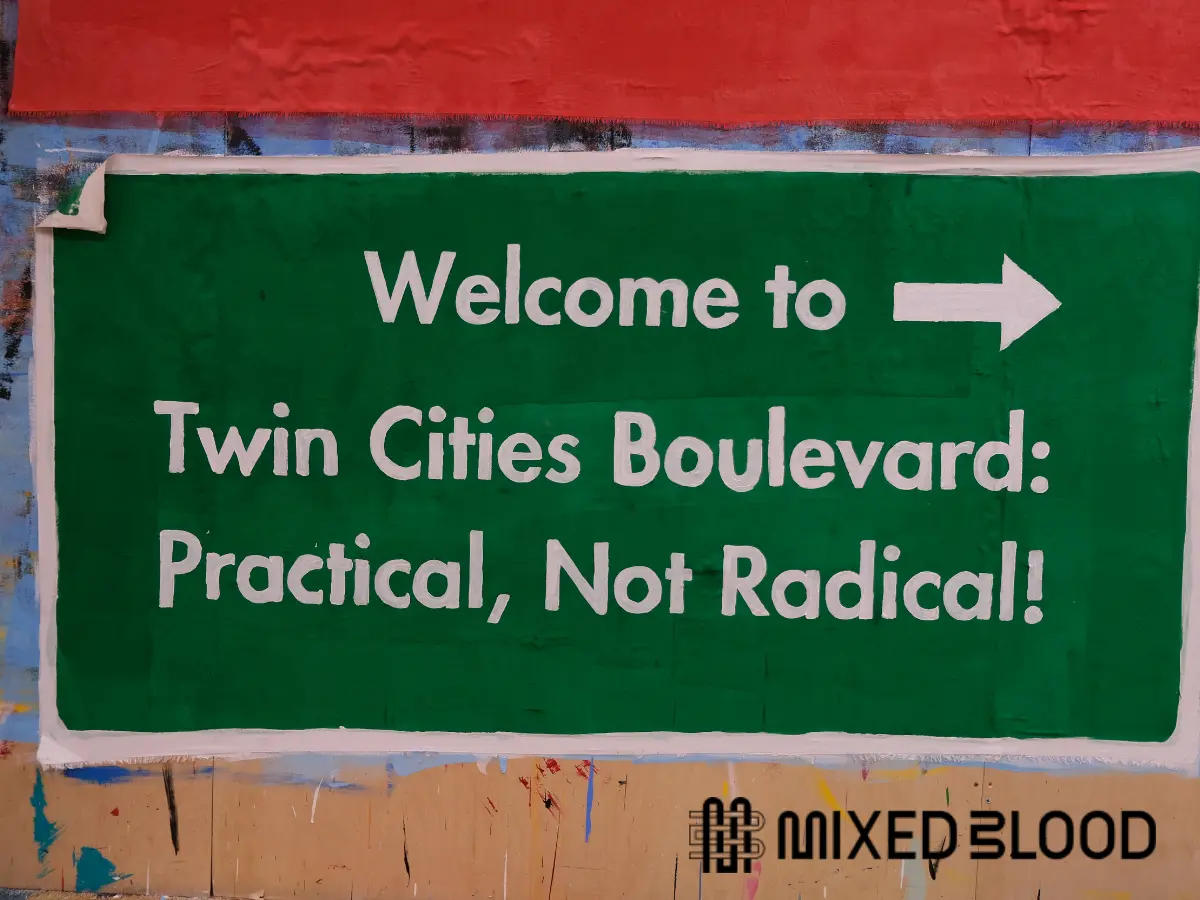 "welcome to twin cities boulevard: practical, not radical!" with mixed blood logo