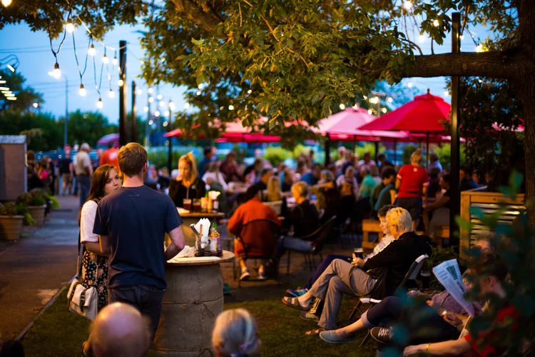 People sitting on Urban Growler's patio.