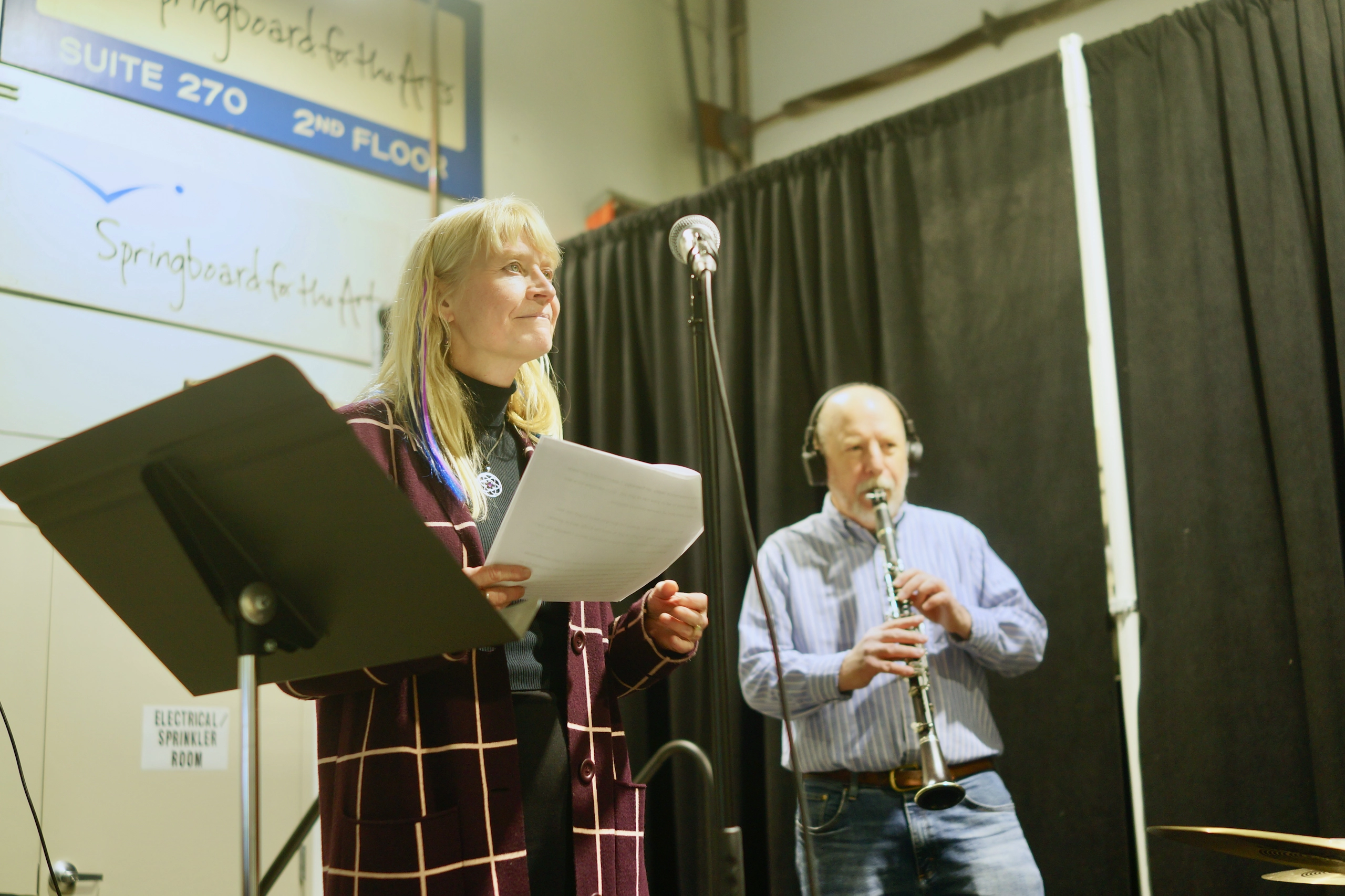 94 Stories Time Machine speaker sharing their story with the band Sonoglyph Collective.